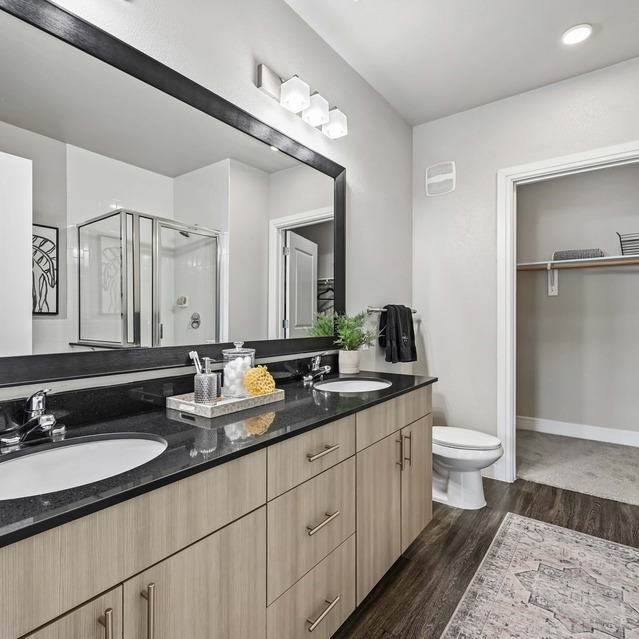 The Arnold - Bathroom with Dual Sinks and Large Mirror