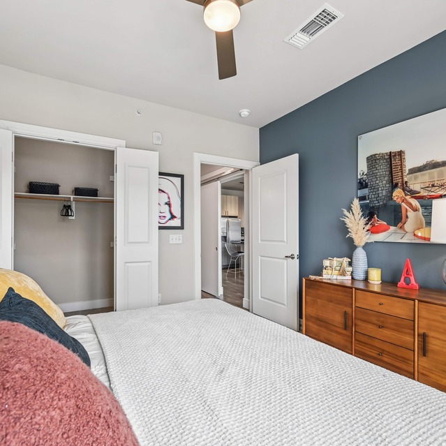 The Arnold - Bedroom with Cozy Carpeted Flooring and Ceiling Fan