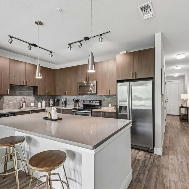 The Arnold - Kitchen with Stainless Steel Appliances and Kitchen Island