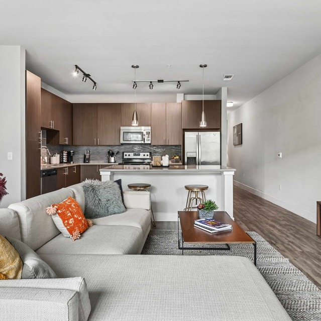 The Arnold - Spacious Living Area with Hardwood Floors